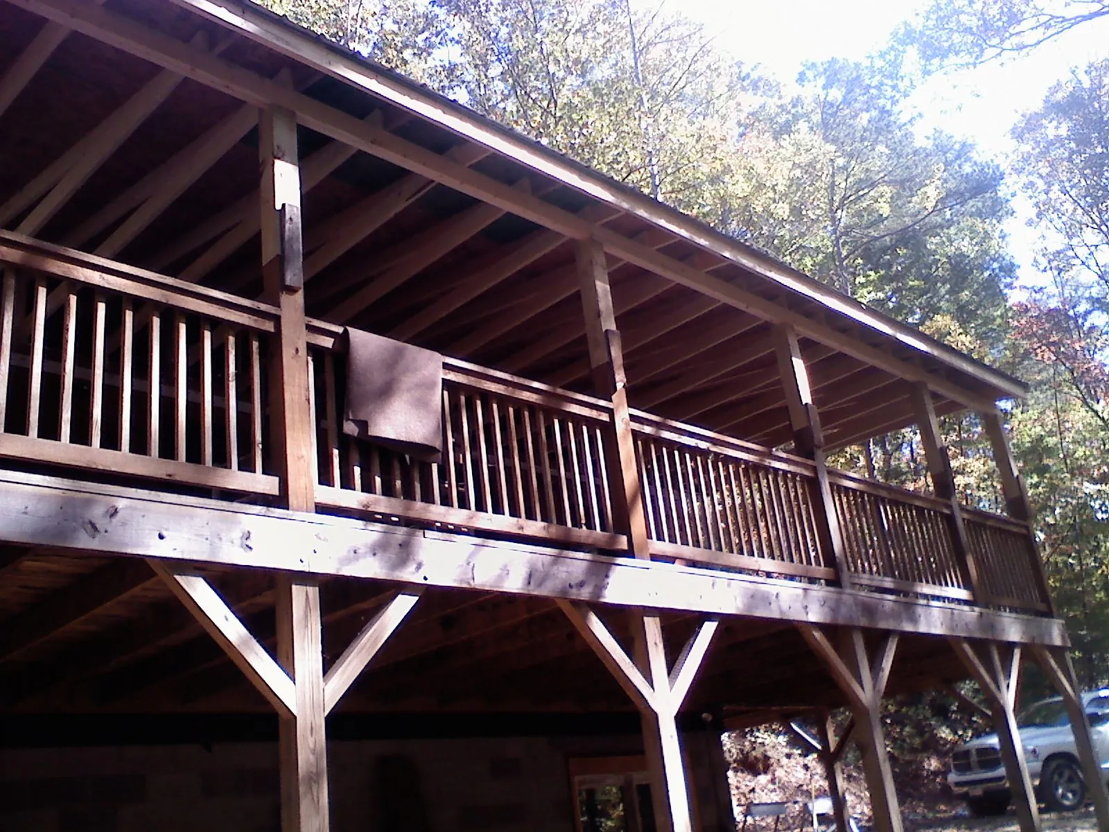 Timber framing under a new elevated porch and deck — Roof Leak Repair in Edmond by Roofing Brothers